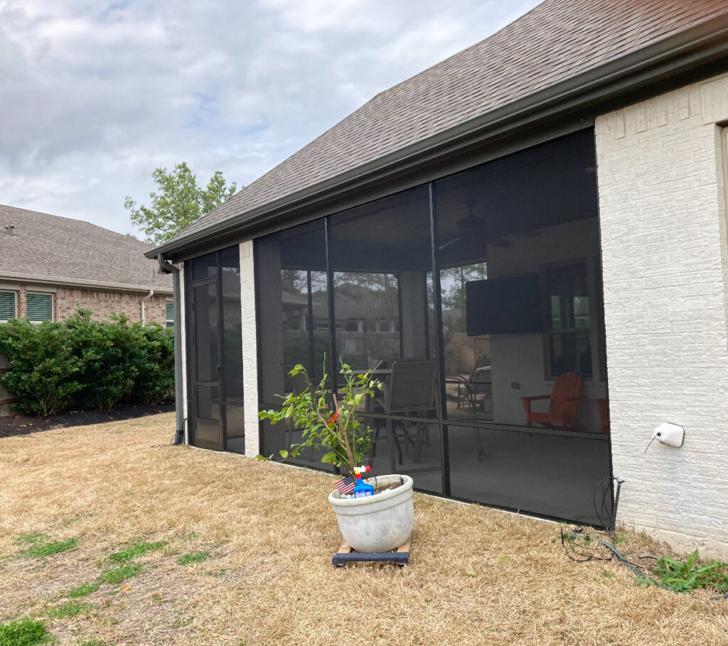 Black mesh patio screen project completed by Metal Masons, blending seamlessly with the home’s exterior for modern curb appeal in Montgomery County.