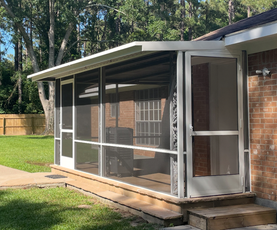 Side angle view of a durable and stylish screen enclosure by Metal Masons, enhancing outdoor comfort for local homeowners.

